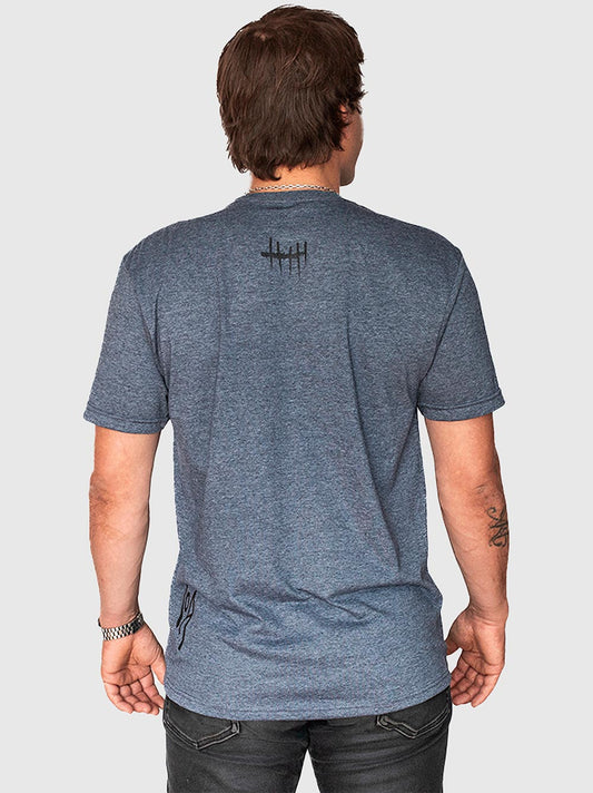 Polera de algodón COA "Días Contado" color azul marino jaspeado, marca chilena de surf — vista trasera